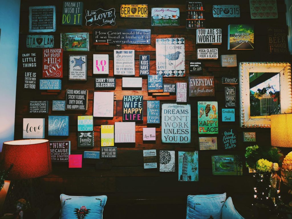 pexels-photo-1742370-1742370 A warm and inviting indoor space with motivational quotes displayed on a wooden wall.