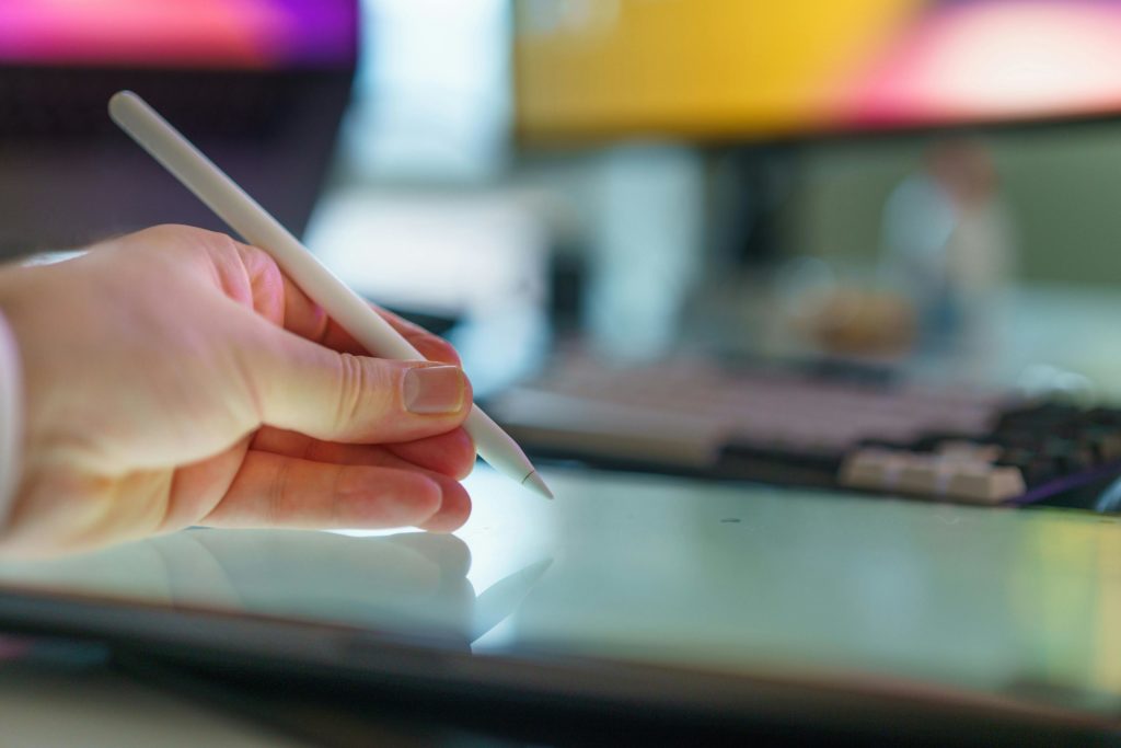 pexels-photo-31738853-31738853 Designer using stylus pen on digital tablet in modern workspace